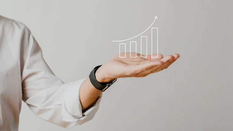 digital-increasing-bar-graph-with-businessman-hand-overlay_53876-97640