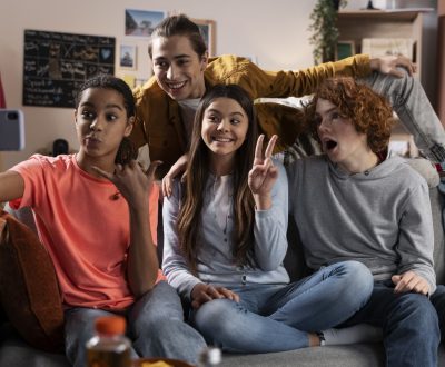 group-teenage-friends-taking-selfie-together-home